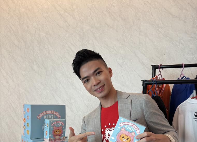 Young Dreammaker with team IP merchandise